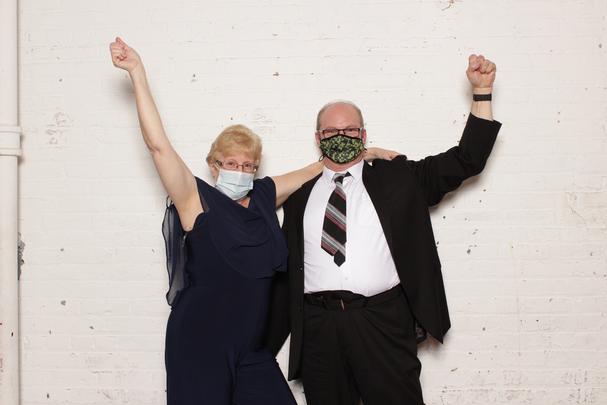 older couple cheers in Art Factory Studios Photo Booth