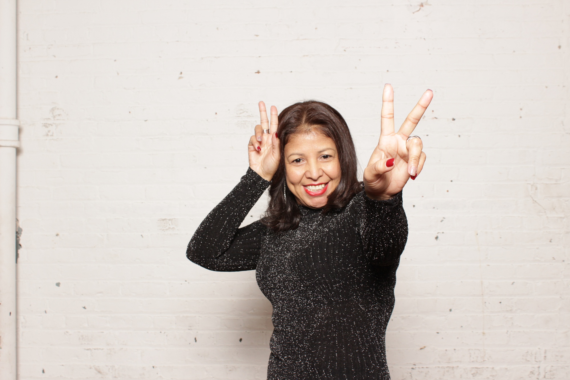 guest gives peace sign during NJ wedding reception