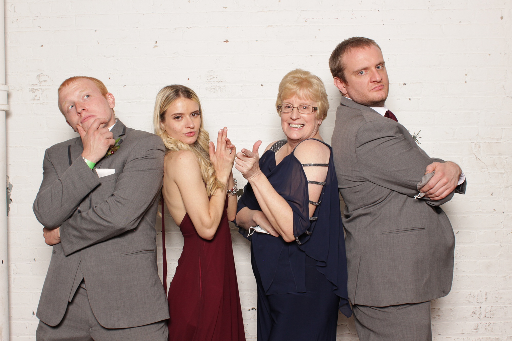 guests pose with parents during New Jersey photo booth