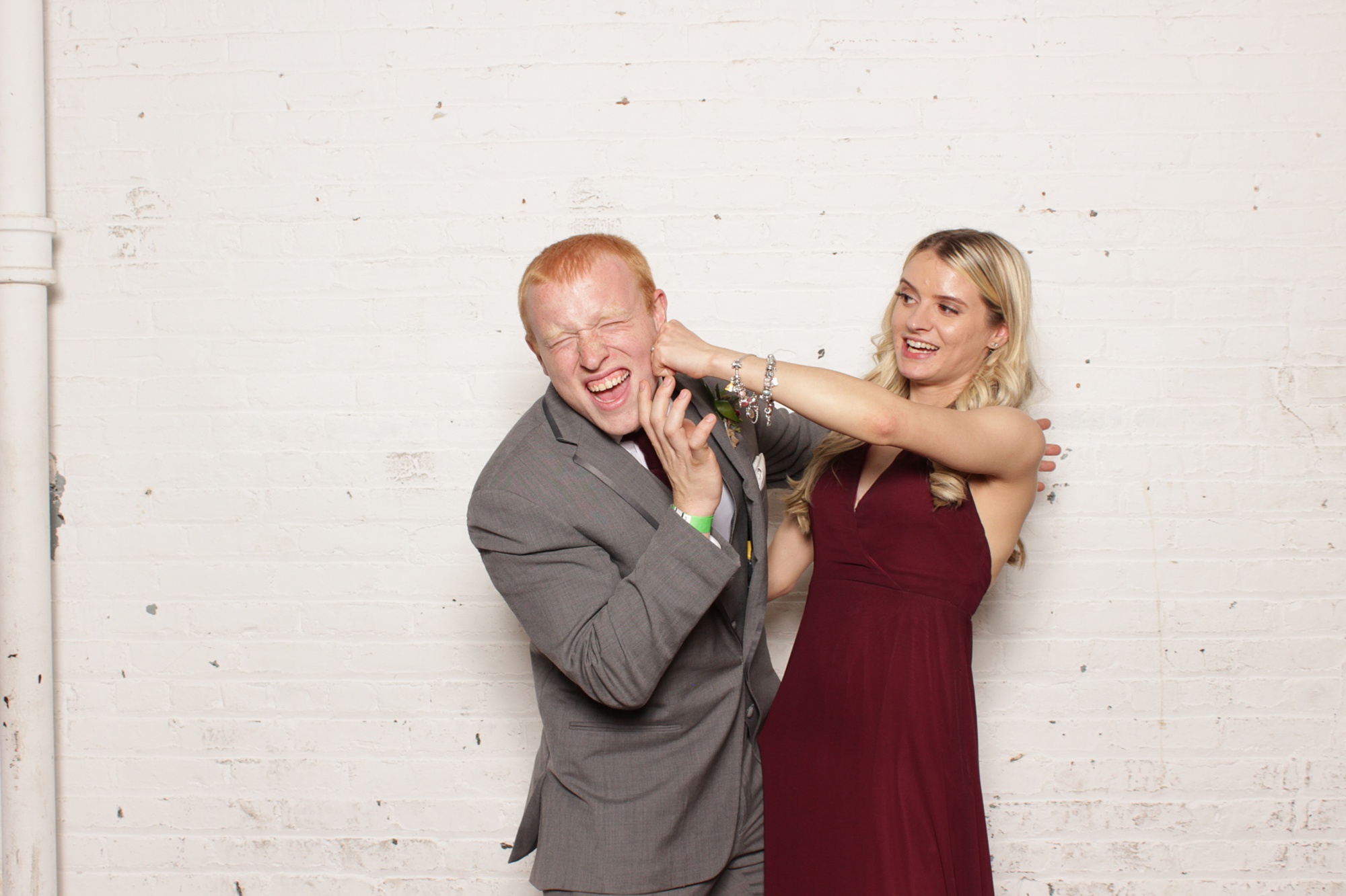 bridesmaids has fun with date during Art Factory Studios Photo Booth