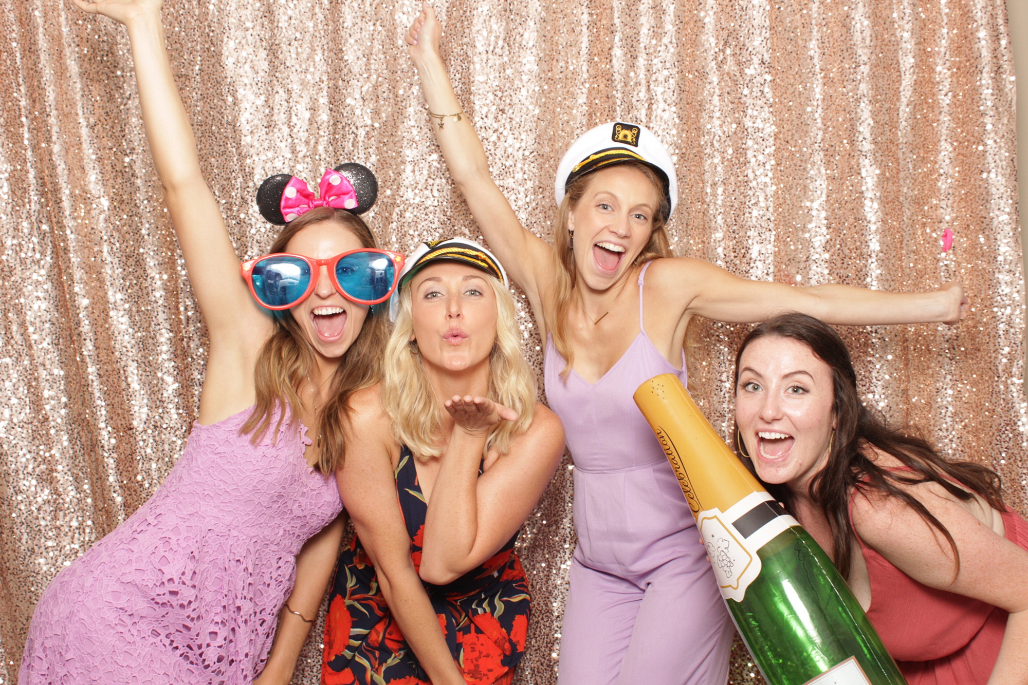 family poses in New Jersey photo booth during reception