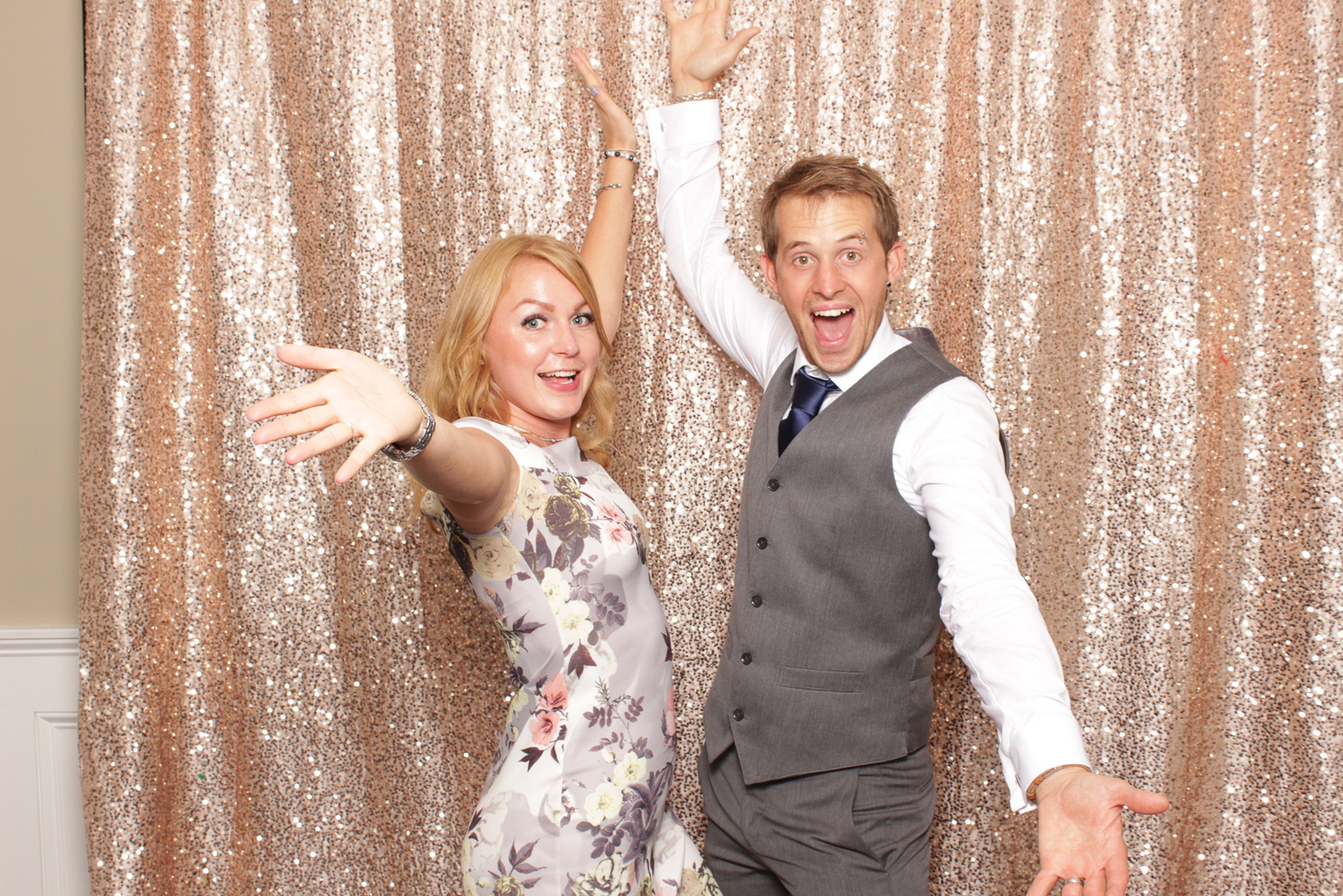 wedding guests pose in New Jersey photo booth at Brant Beach Yacht Club