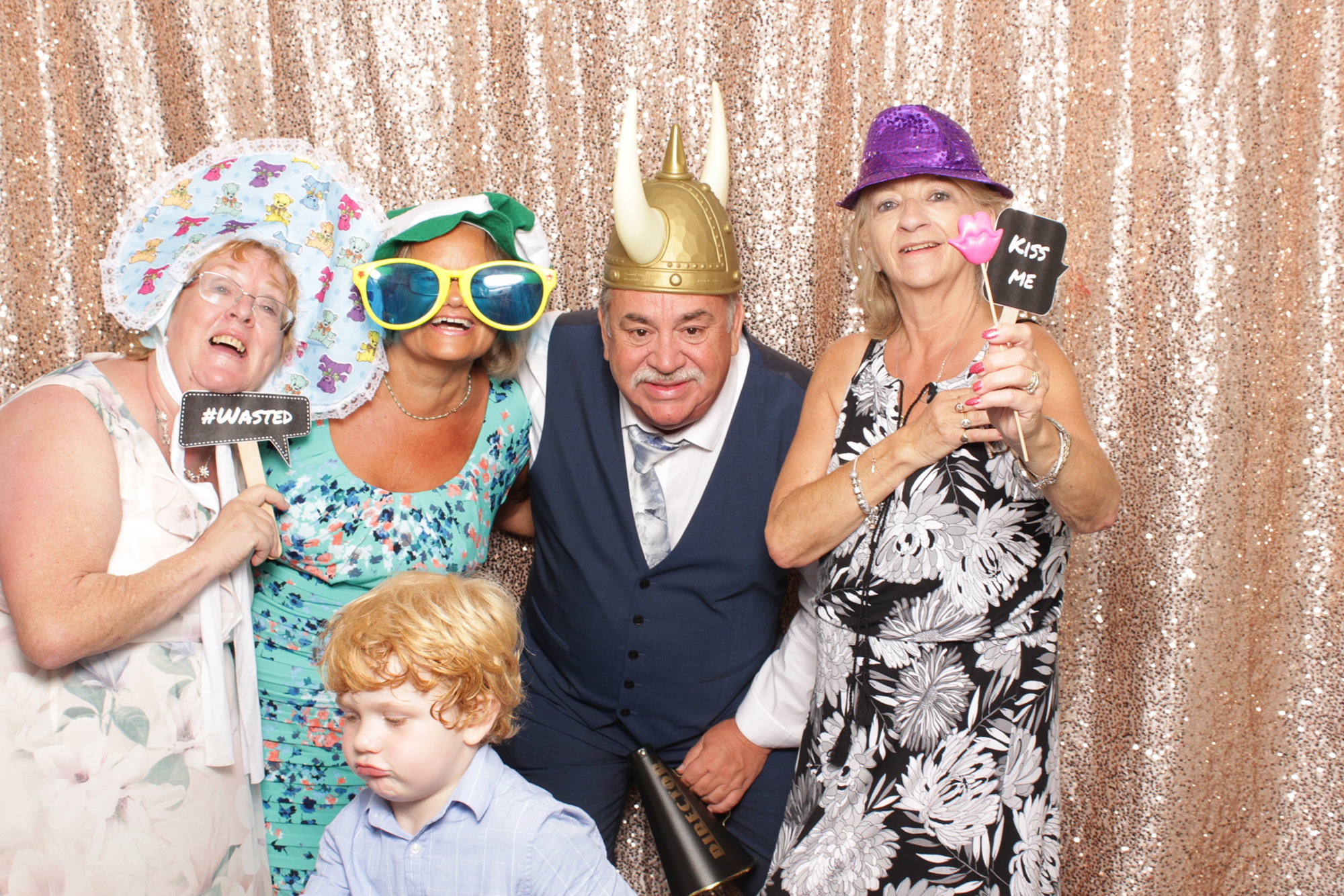 family plays in photo booth at Brant Beach Yacht Club