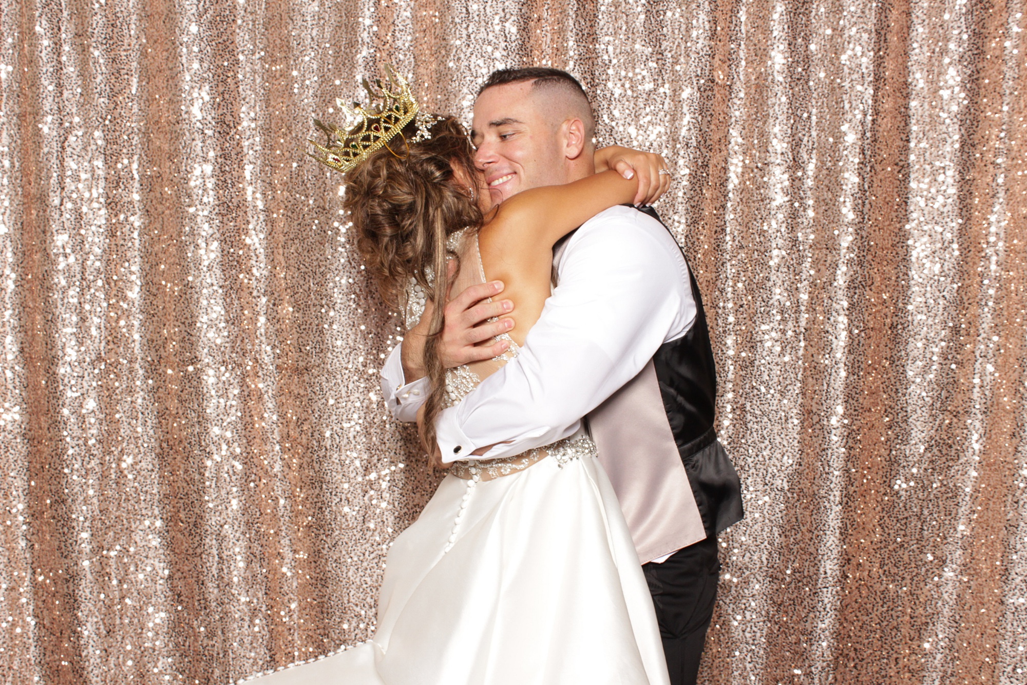 newlyweds hug in Park Chateau Estate Photo Booth