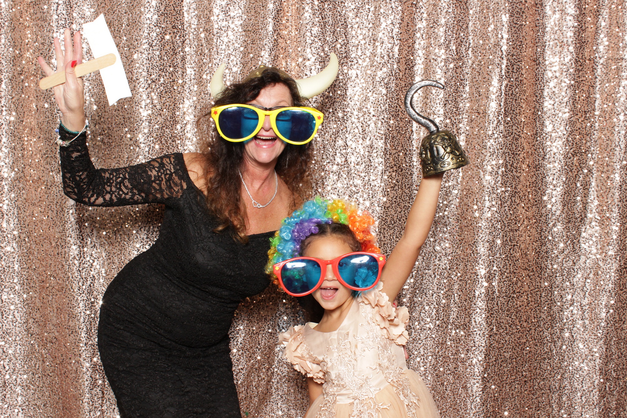 mom and daughter pose in photo booth in New Jersey