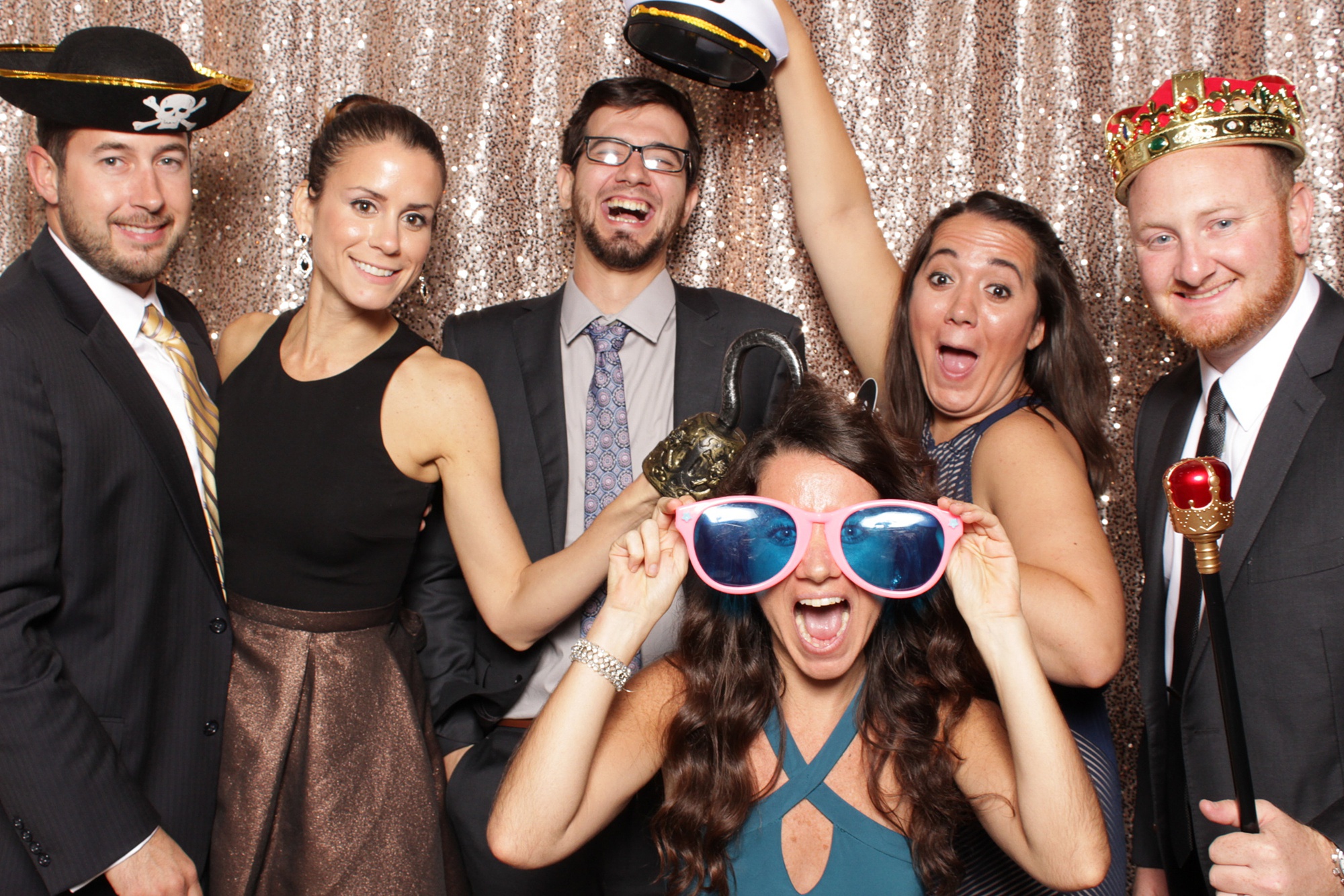 group poses in photo booth during NJ reception