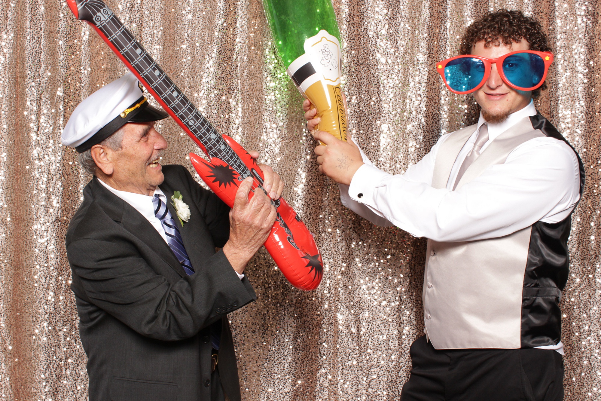 guys battle with inflatable props during NJ photo booth