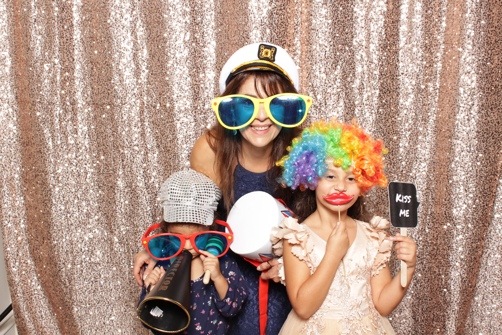 mom poses with kids during reception fun