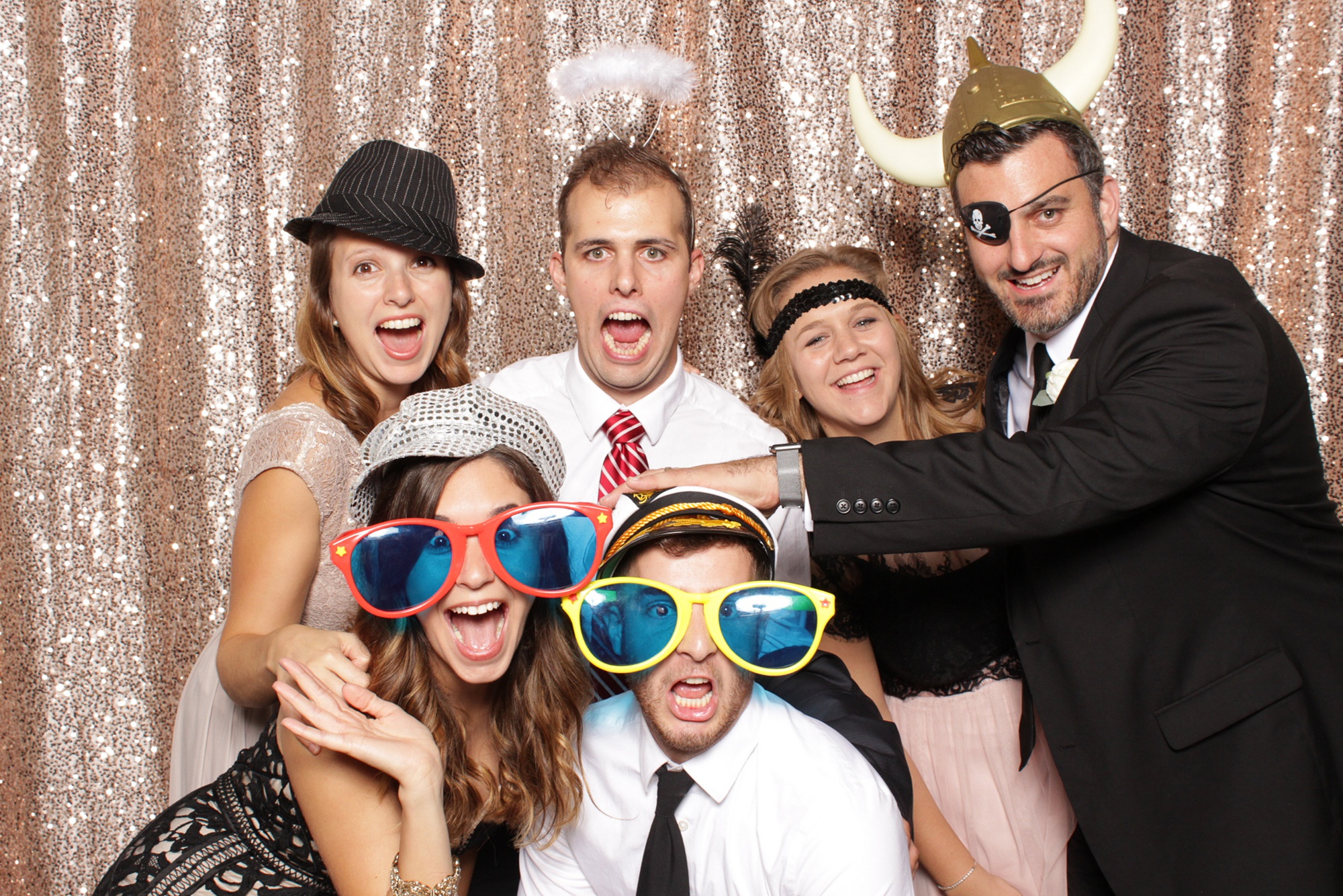 family makes faces in photo booth in New Jersey