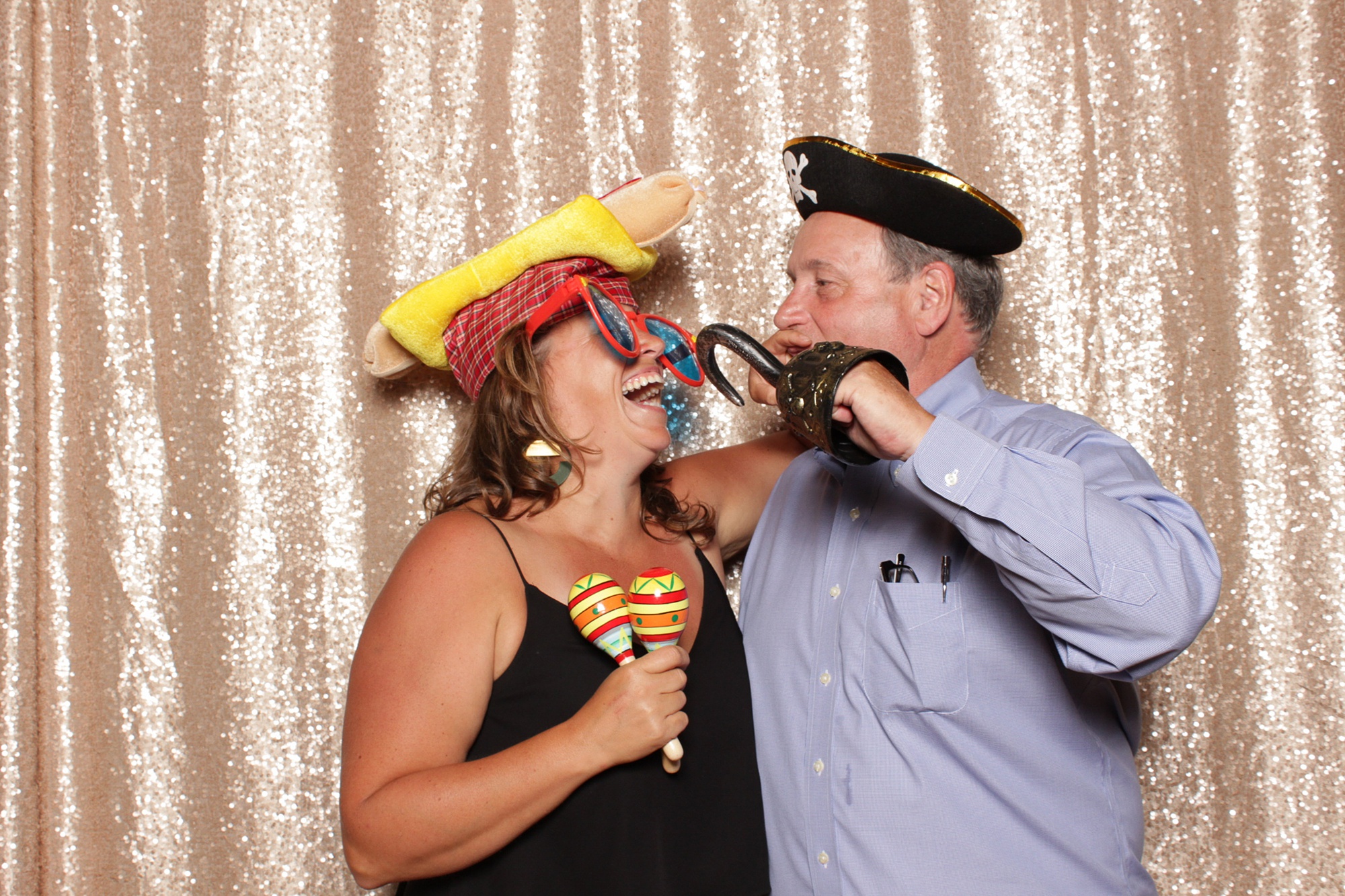guests play with pirate hook during NJ wedding photo booth