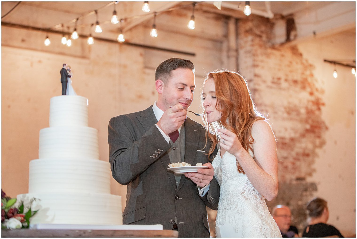 bride and groom enjoy wedding cake in New Jersey reception 