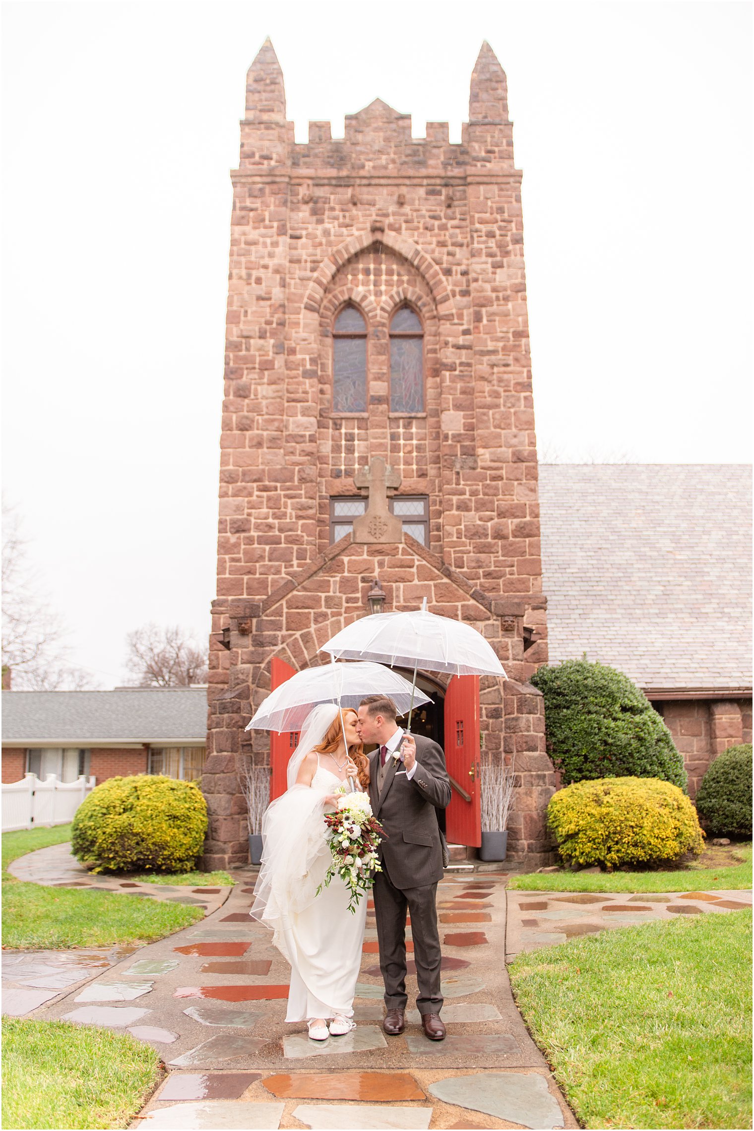 rainy wedding portraits after traditional church wedding ceremony at Grace Episcopal Church in Nutley