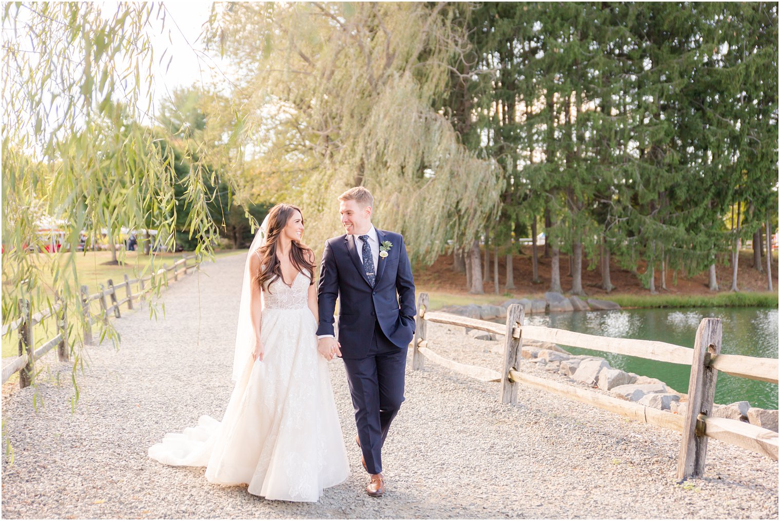 Bride and groom walking at Windows on the Water at Frogbridge