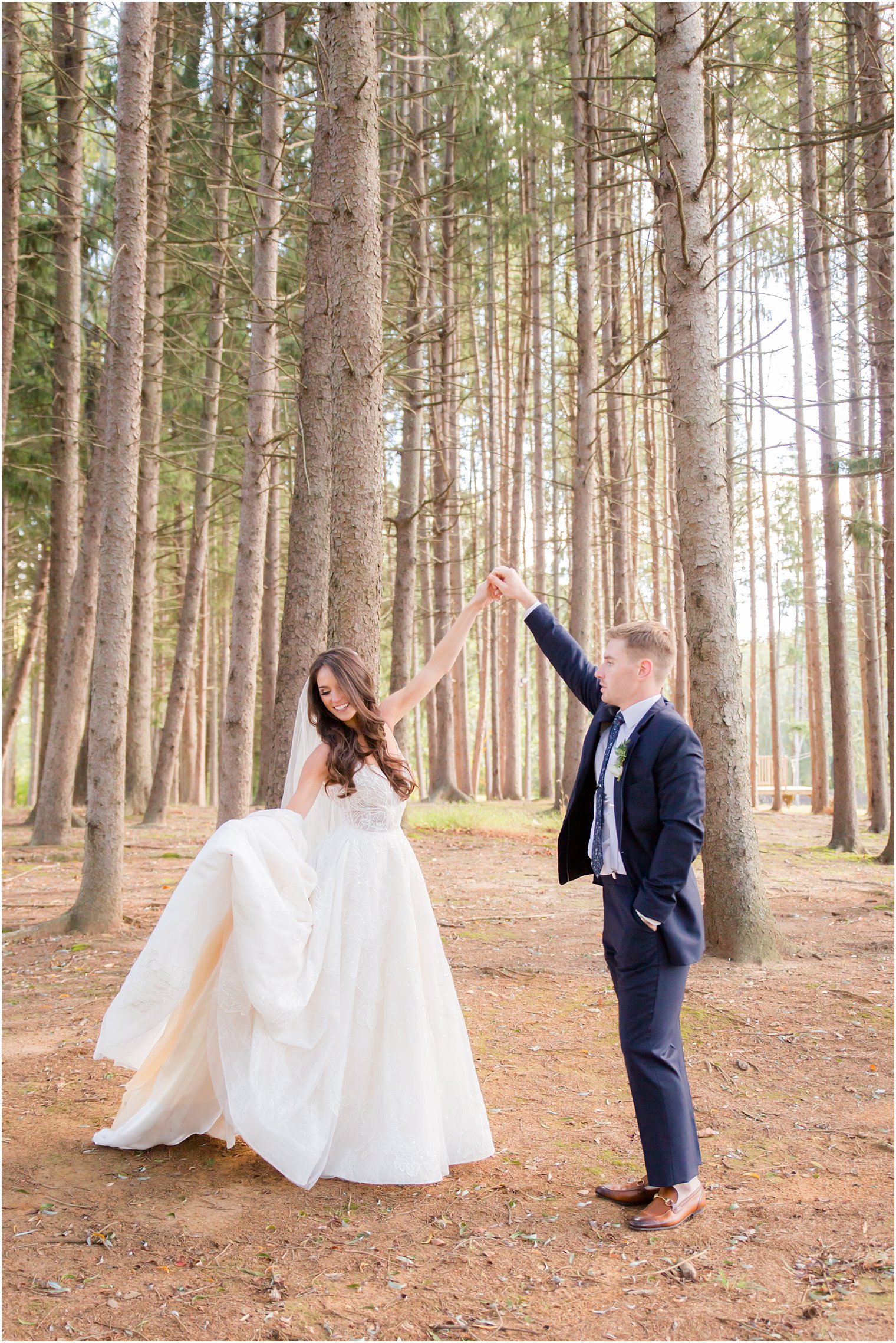 Bride and groom dancing in the woods at Windows on the Water at Frogbridge