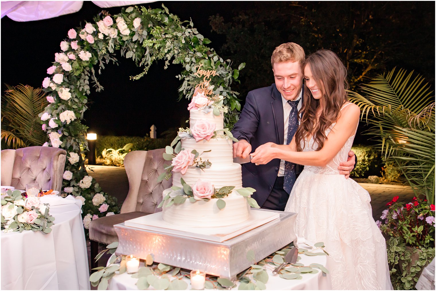 Bride and groom cutting cake at Windows on the Water at Frogbridge