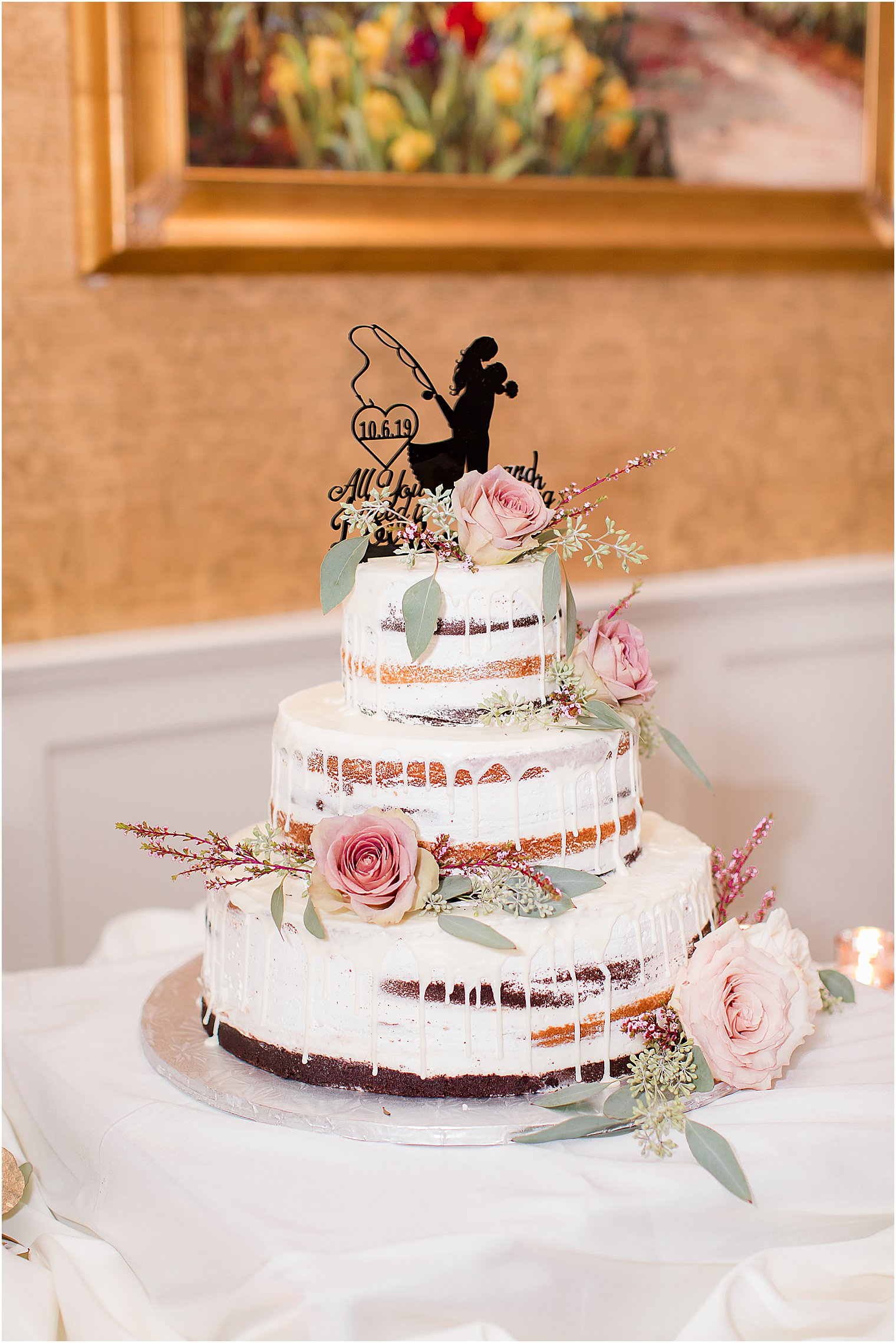 naked wedding cake with black topper from Bovella's Pastry Shoppe
