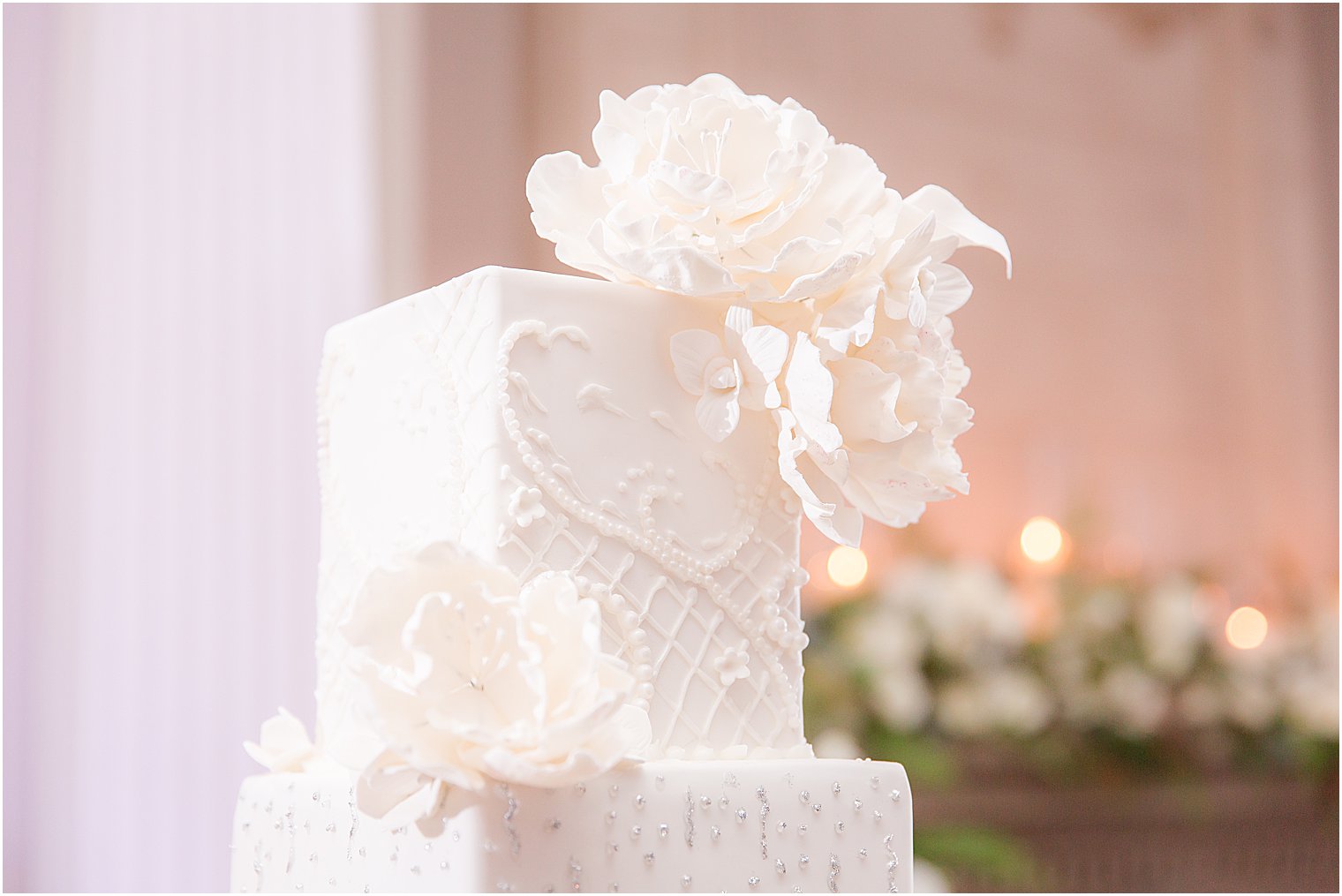 elegant wedding cake with intricate sugar work from My Daughter's Cakes