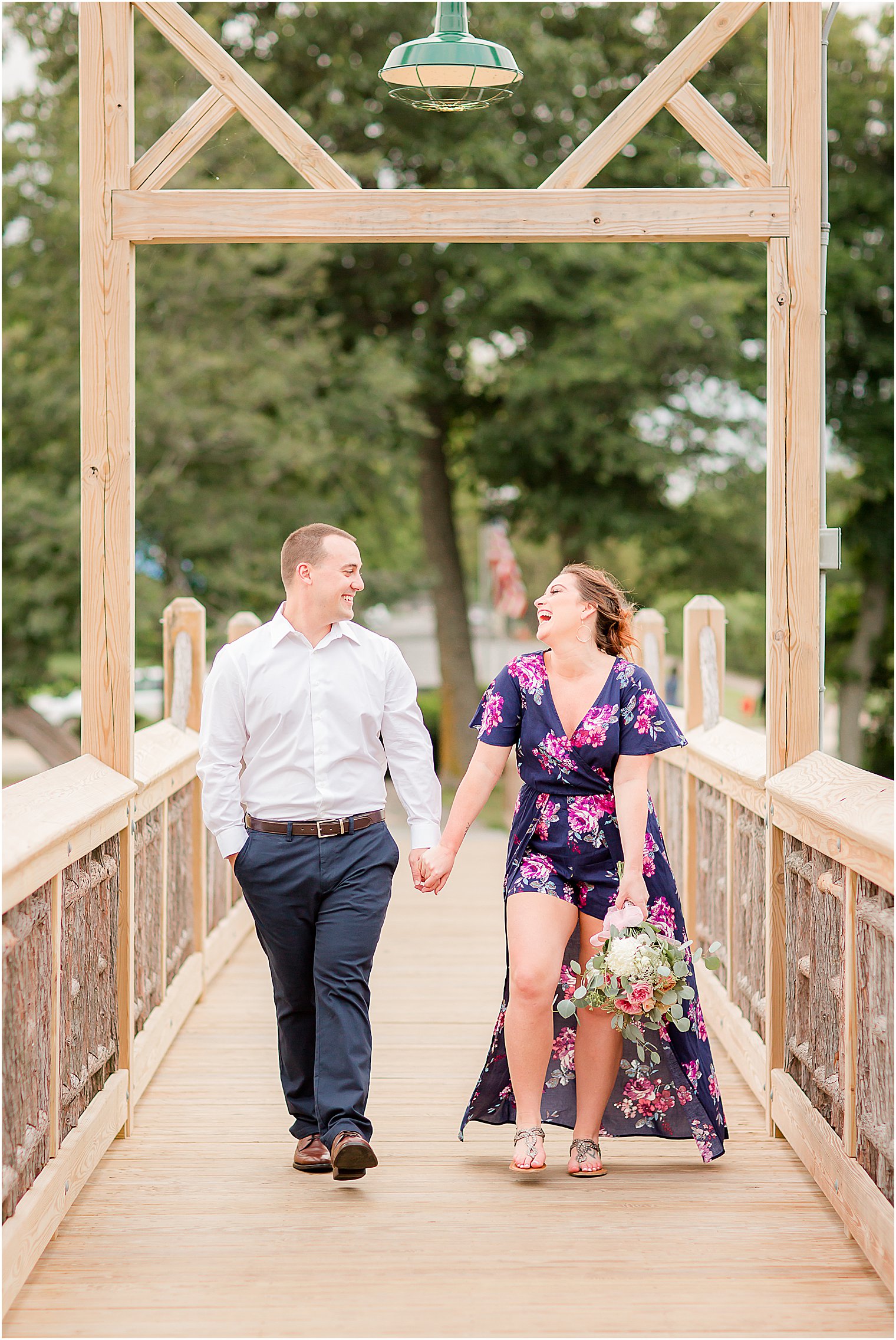 Couple walks on bridge during New Jersey engagement photos