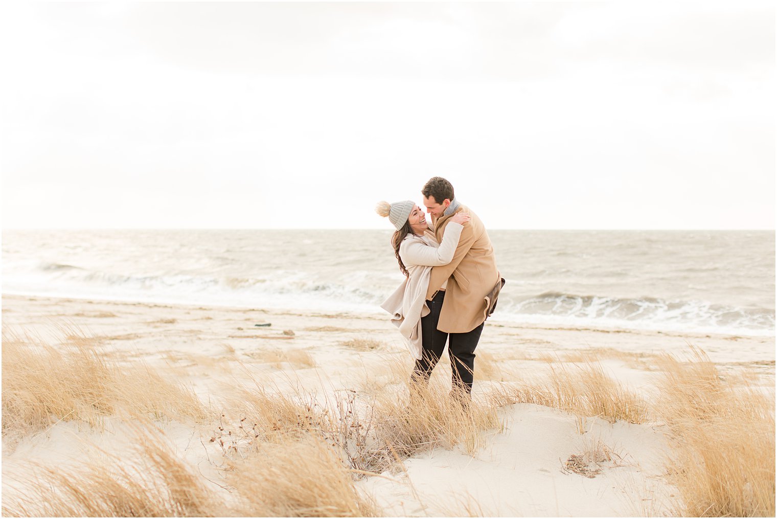 Couple laughing on the beach in Cape May