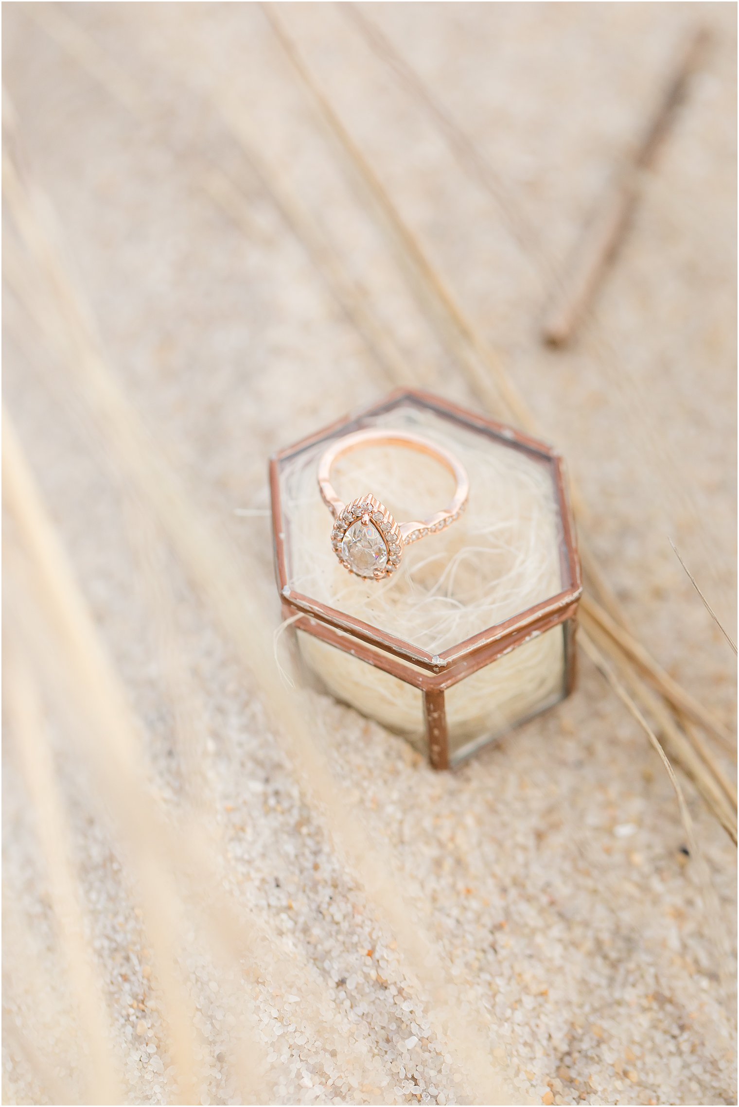 Pear shaped engagement ring in a geometric glass box