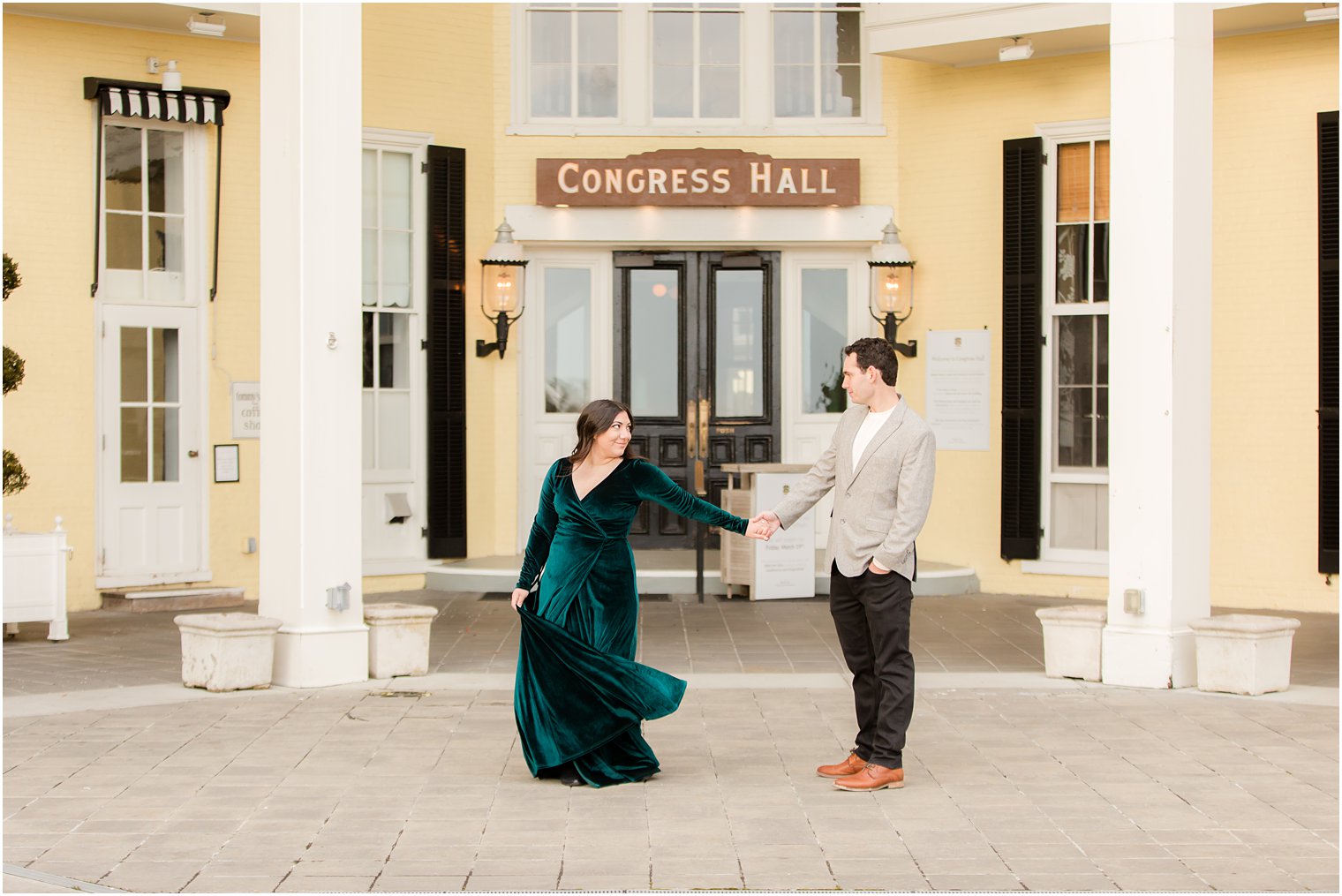 Couple dancing in front of Congress Hall in Cape May for their engagement photos