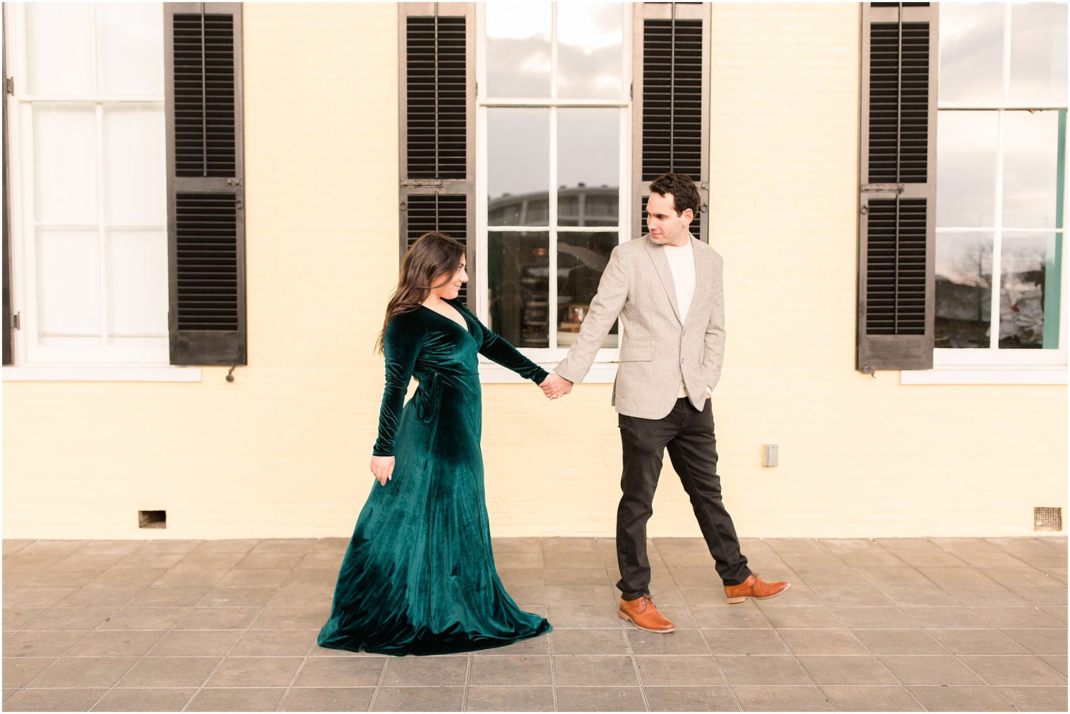 Couple walking in front of Congress Hall in Cape May for their engagement photos