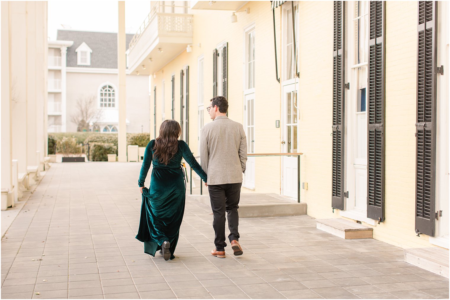 Engaged couple walking away during Cape May engagement session