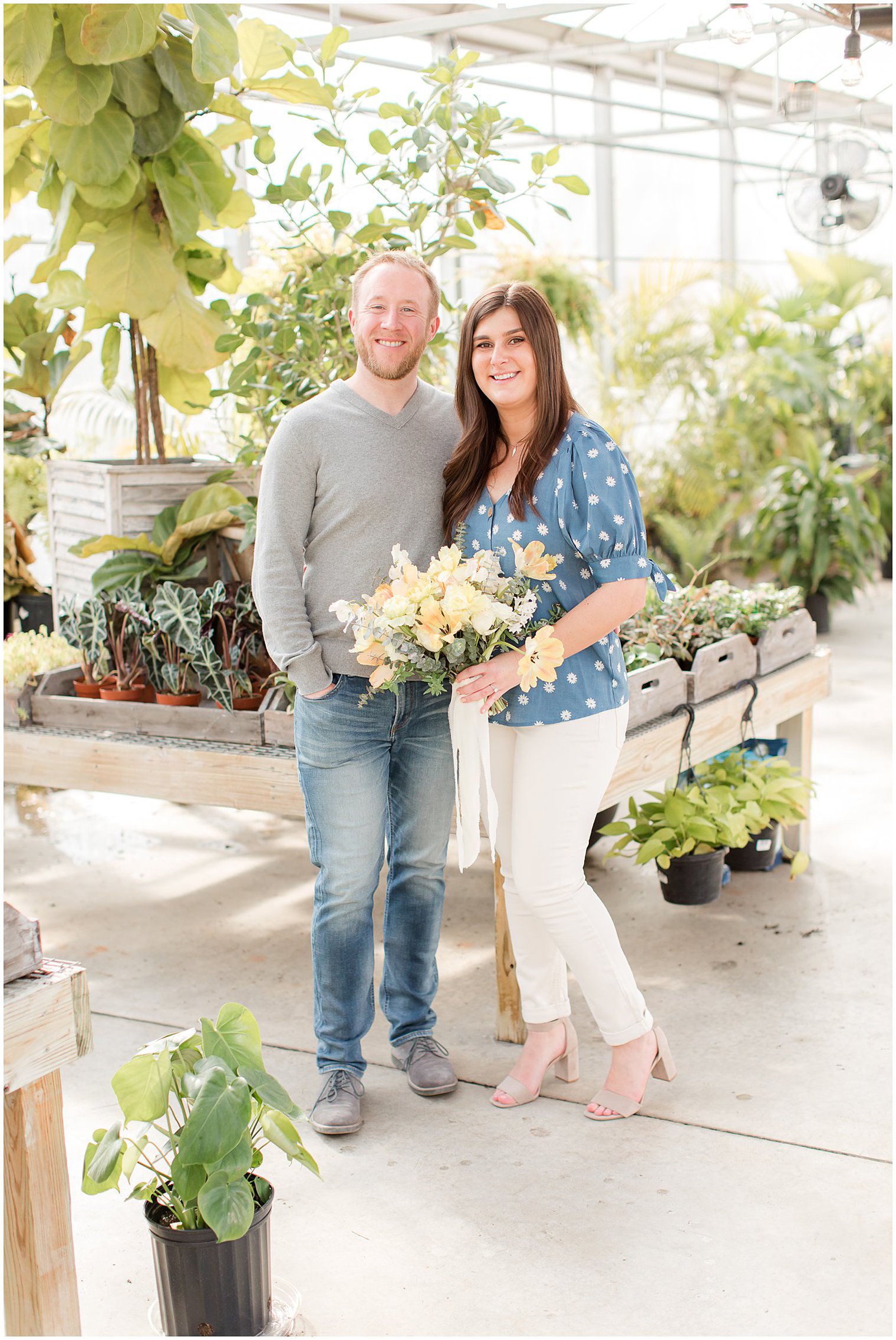 bride and groom pose in New Jersey with yellow bouquet