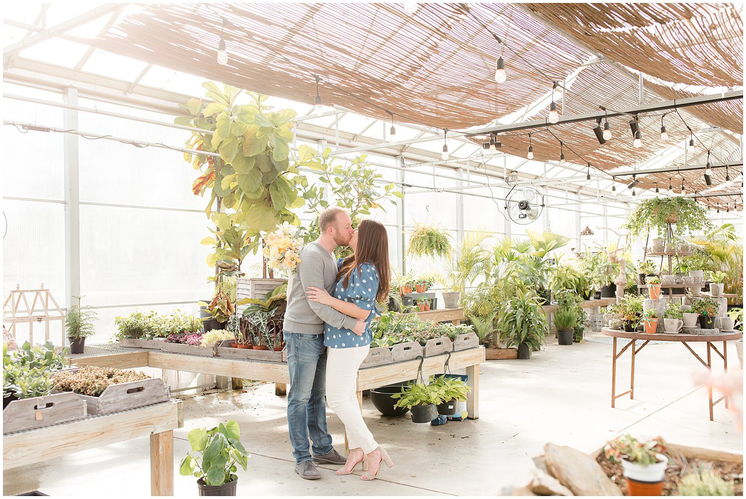 bride and groom kiss in New Jersey greenhouse at Herbary at Bear Creek