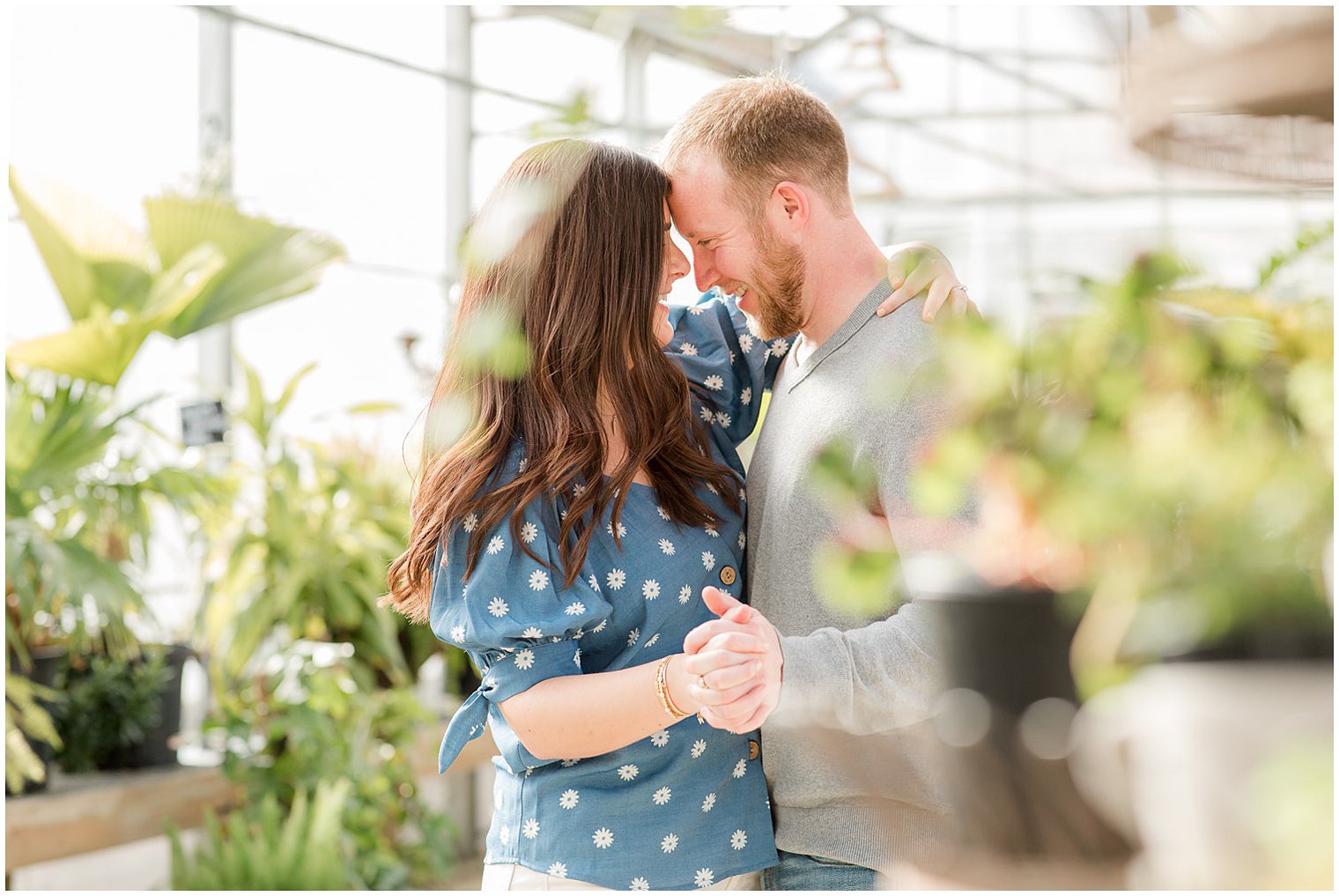 NJ couple dances in Herbary at Bear Creek greenhouse during engagement photos