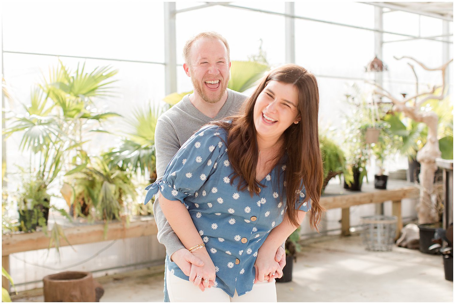 bride and groom laugh during New Jersey engagement photos in Herbary at Bear Creek