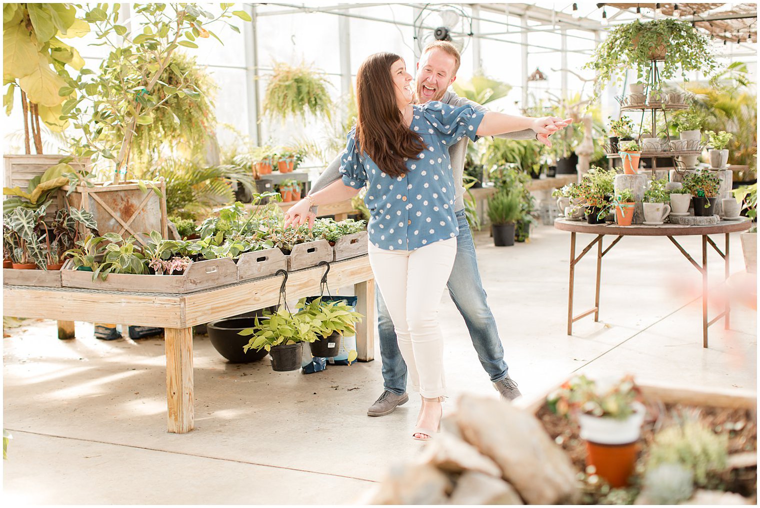 bride and groom laugh dancing during Herbary at Bear Creek engagement photos