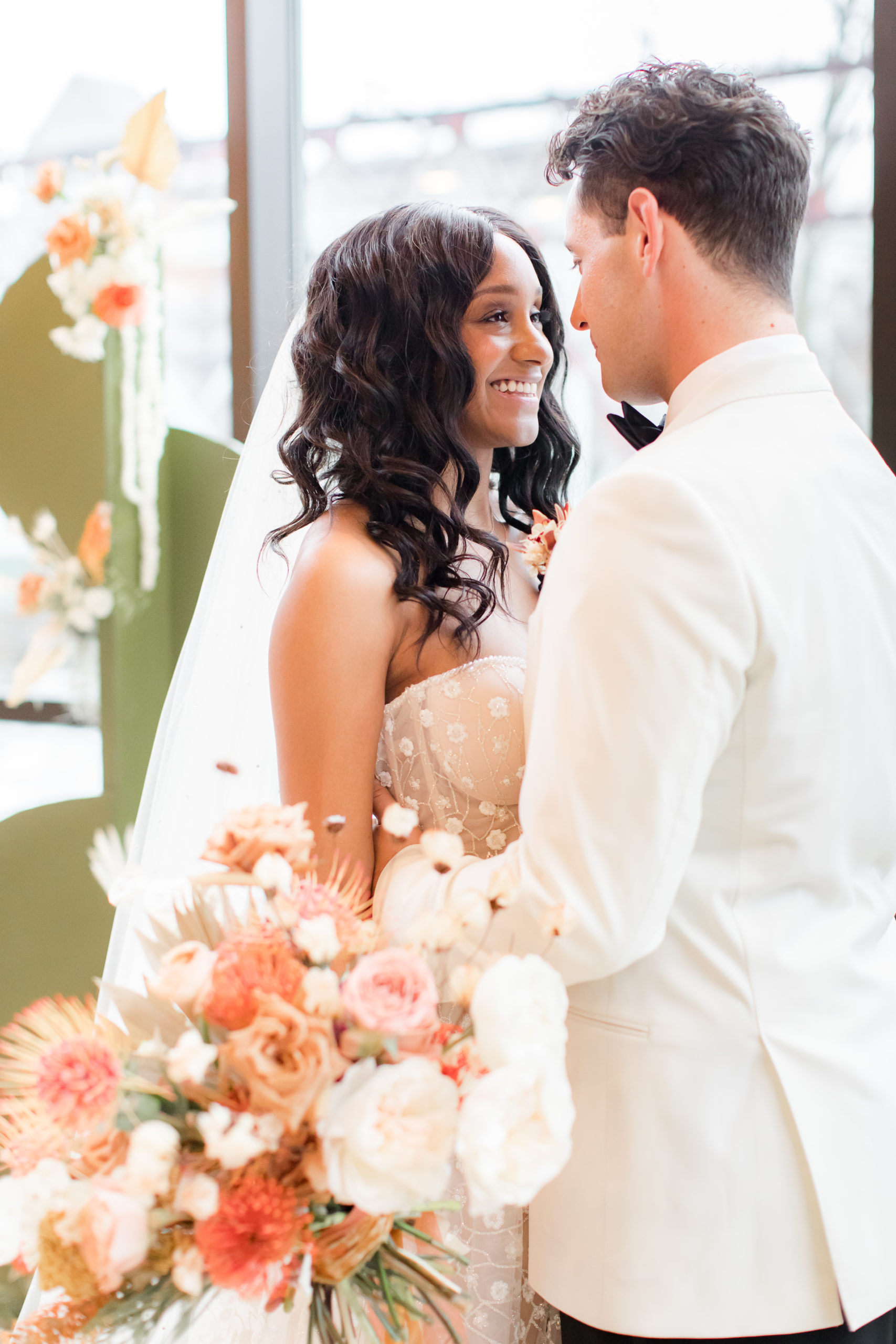 bride smiles at groom during modern wedding at Ironworks at Pencoyd Landing