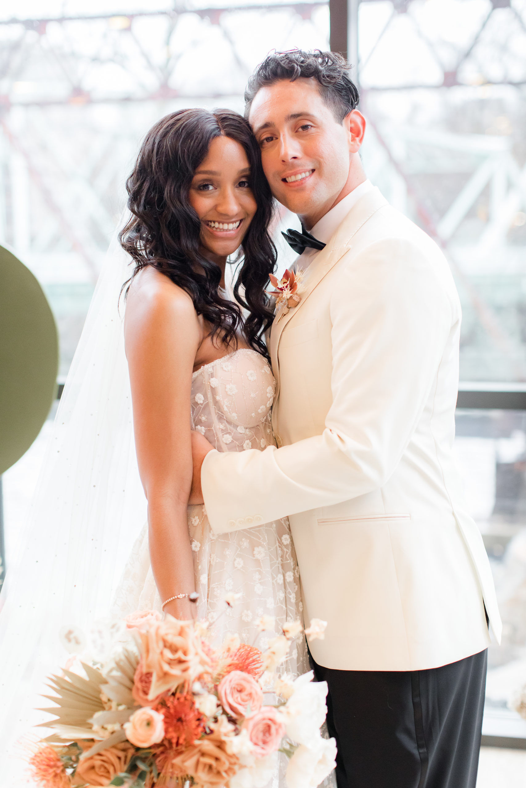 newlyweds lean heads together during Philadelphia wedding day at Ironworks at Pencoyd Landing