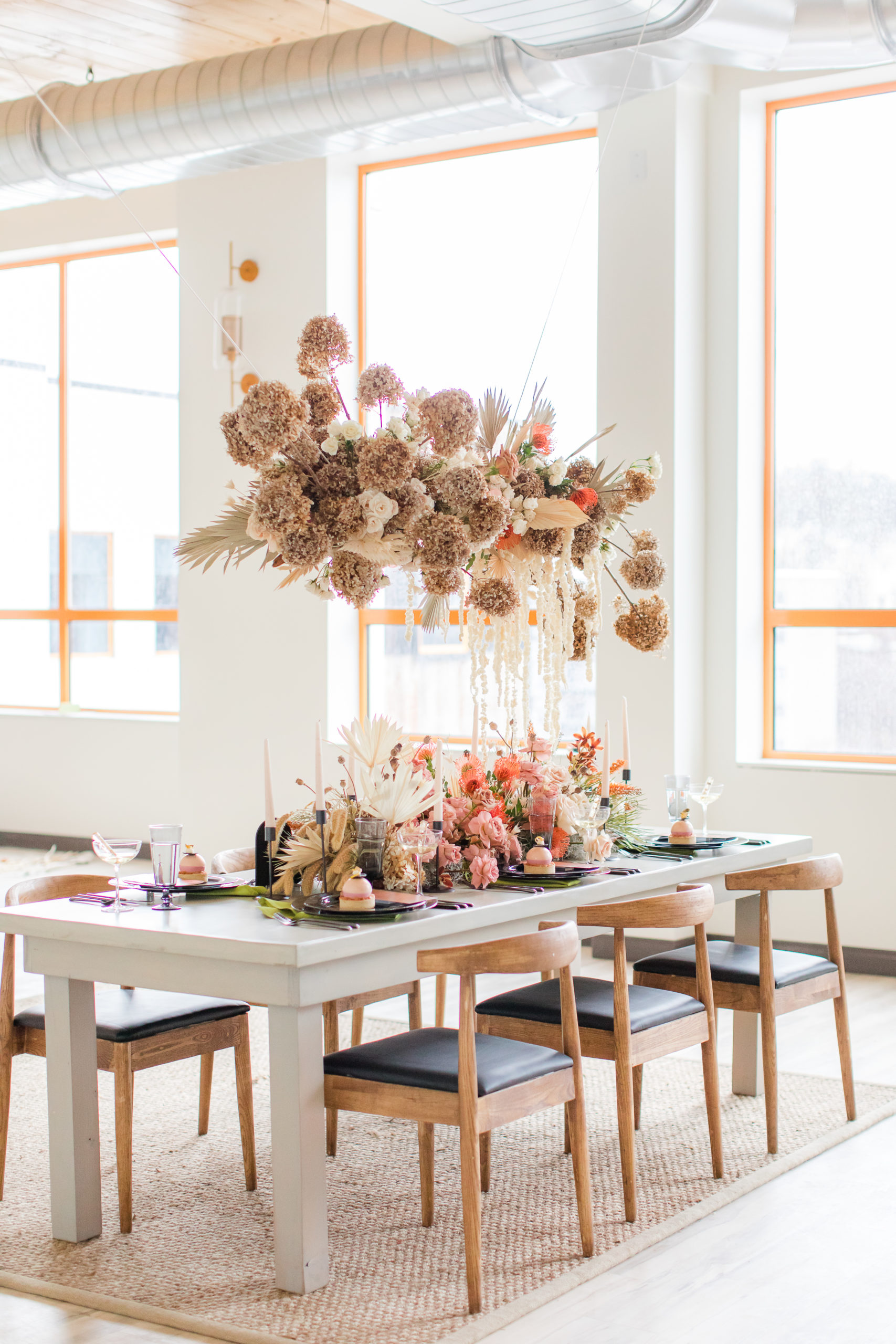modern centerpieces at Ironworks at Pencoyd Landing wedding reception with brown and pink florals