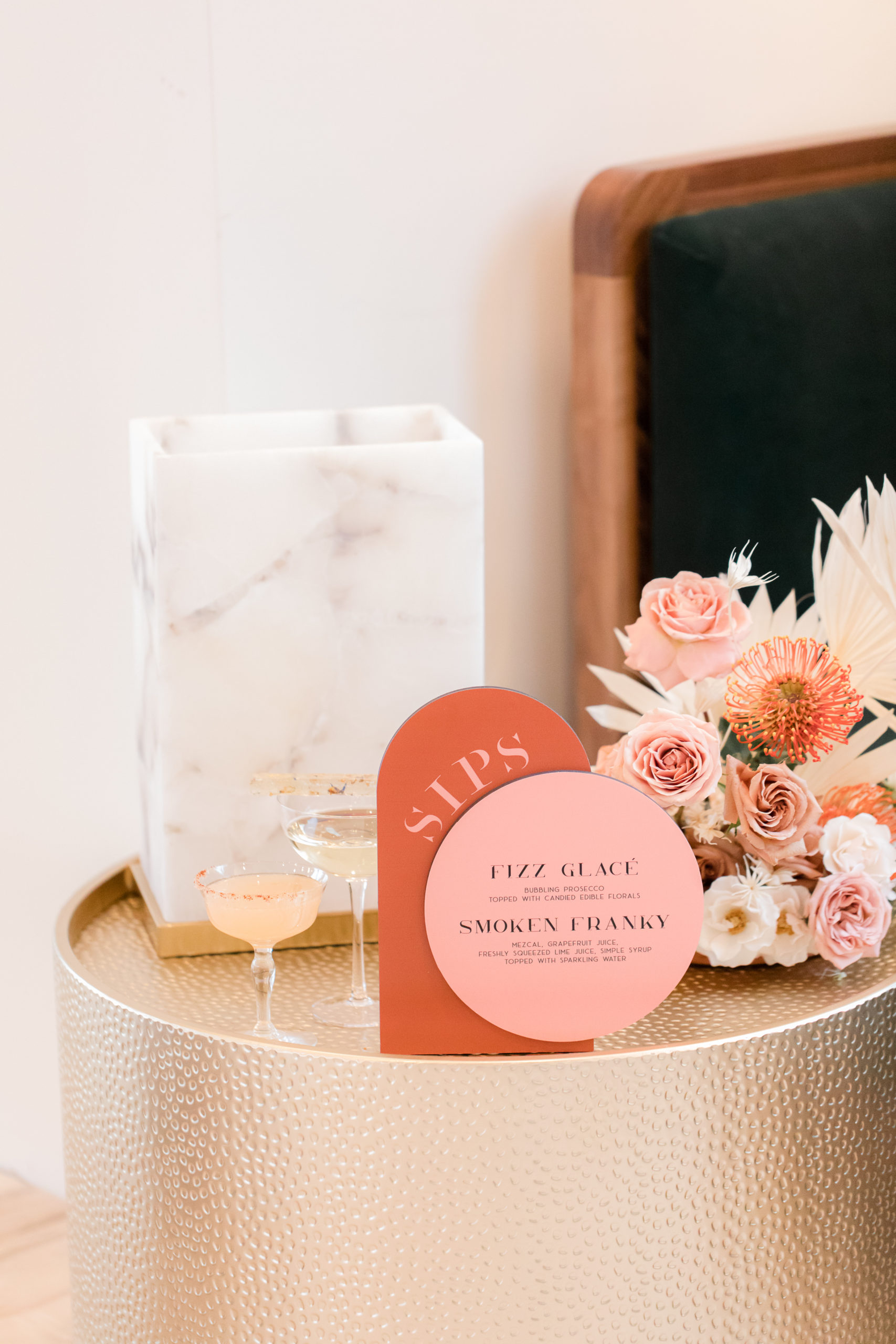 champagne station with pink and orange sign