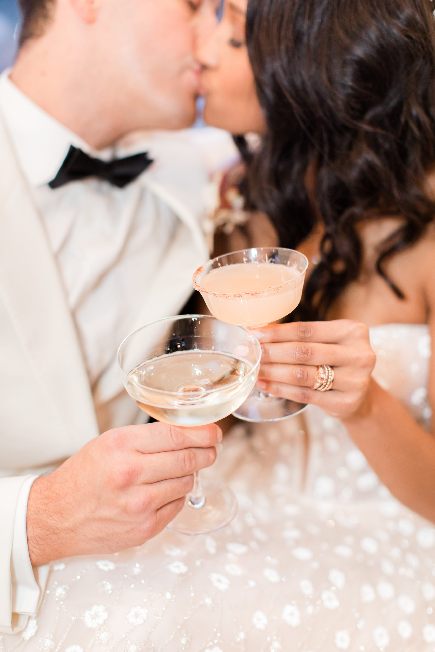 newlyweds toast signature cocktails during Ironworks at Pencoyd Landing wedding reception 
