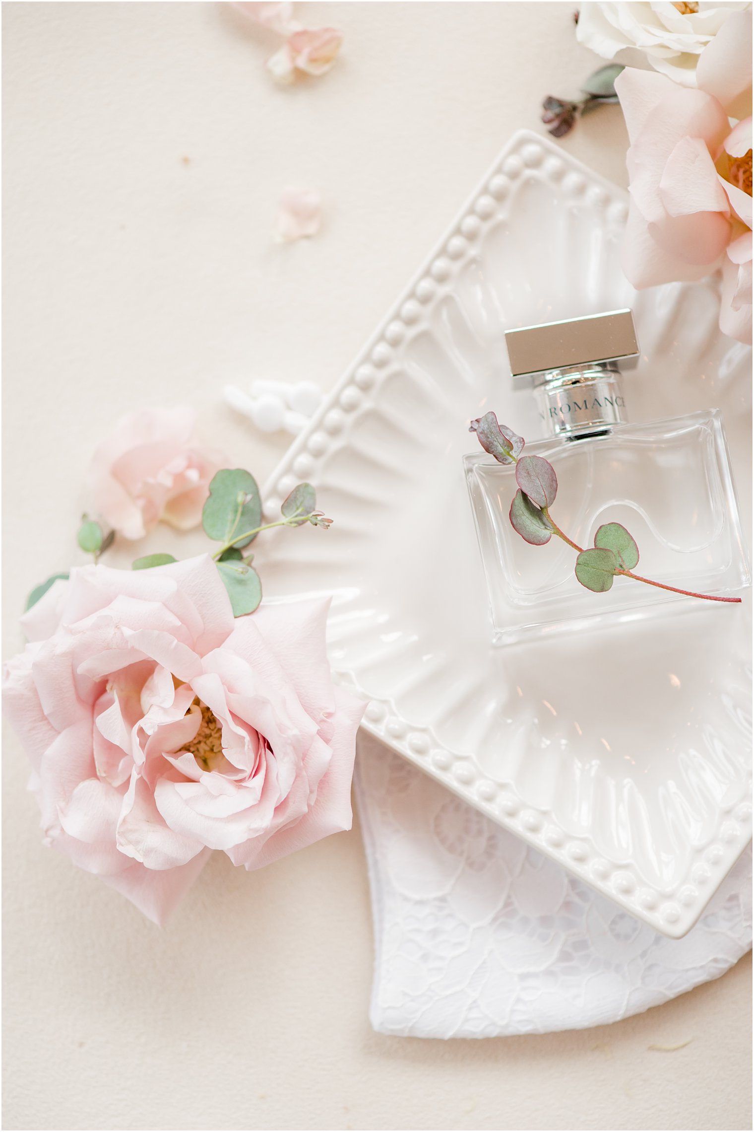 bride's perfume on ivory tray