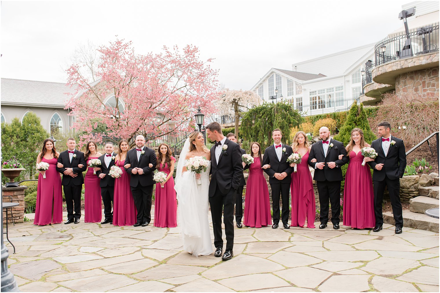 bride and groom pose with large bridal party at Park Savoy Estate