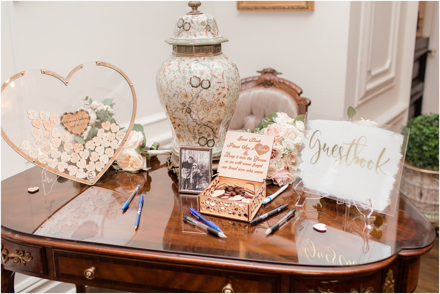 guest book with antique vase and wooden hearts at Park Savoy 