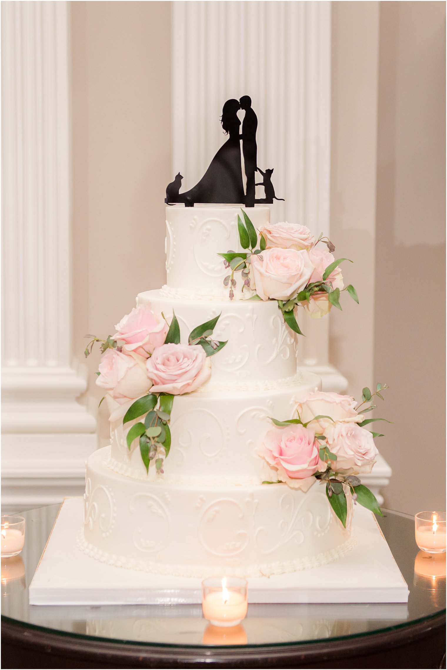 tiered wedding cake with silhouette cake topper with two cats