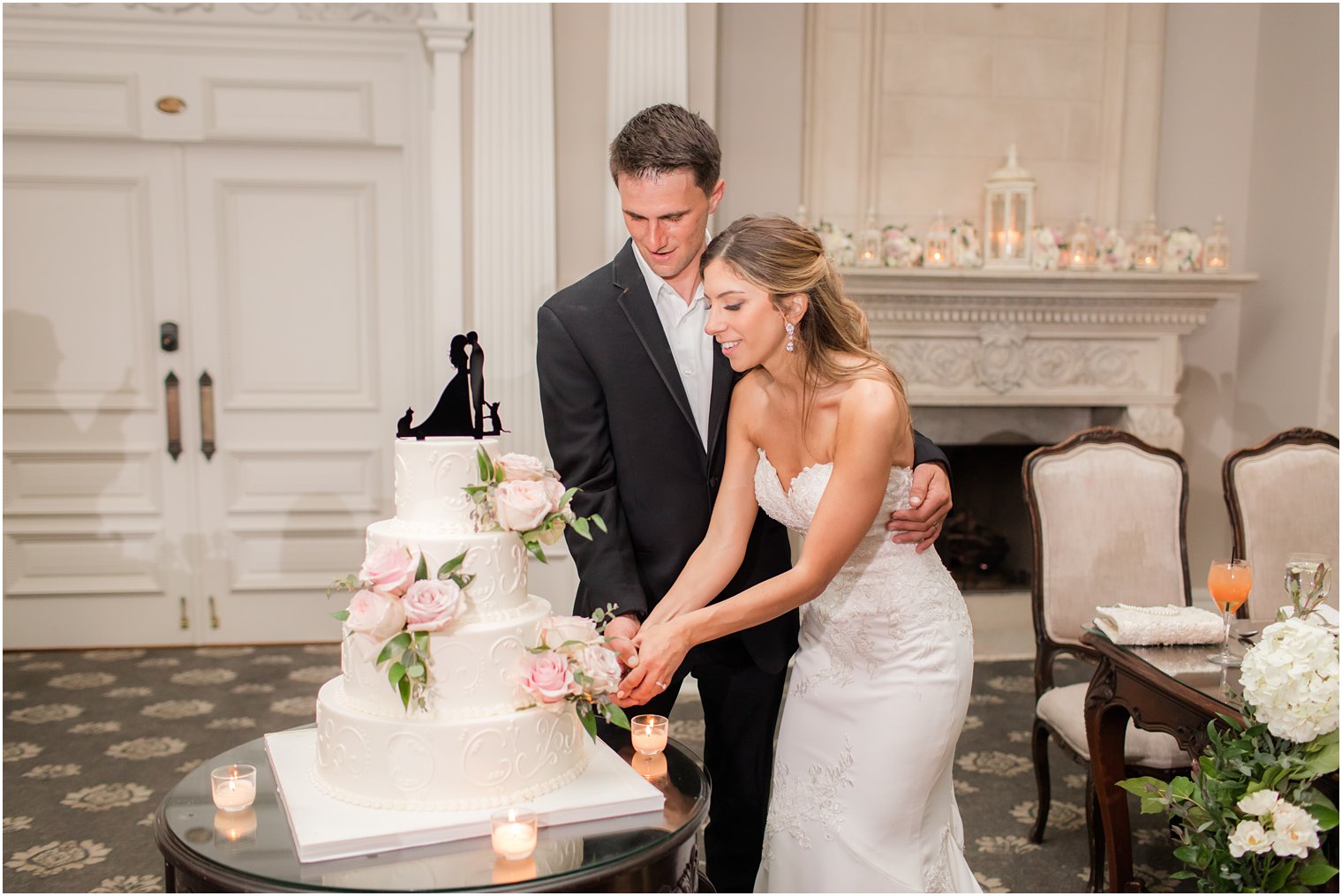 bride and groom cut wedding cake during Florham NJ wedding reception