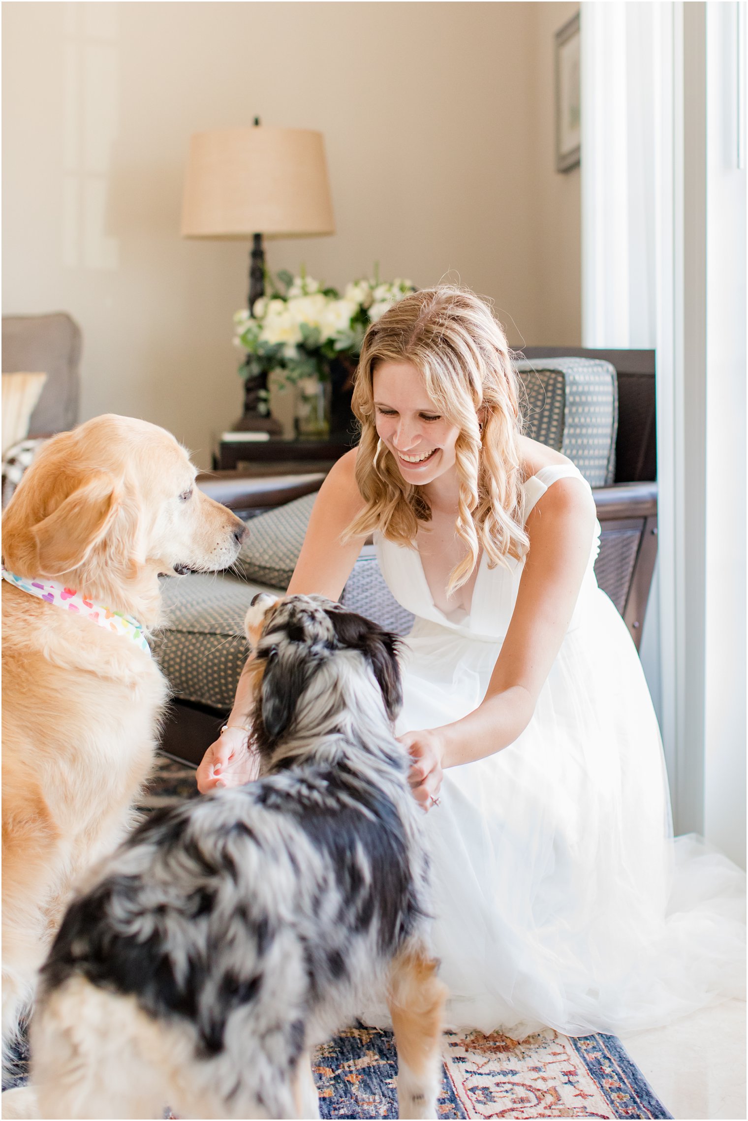 bride pets two dogs before NJ wedding day