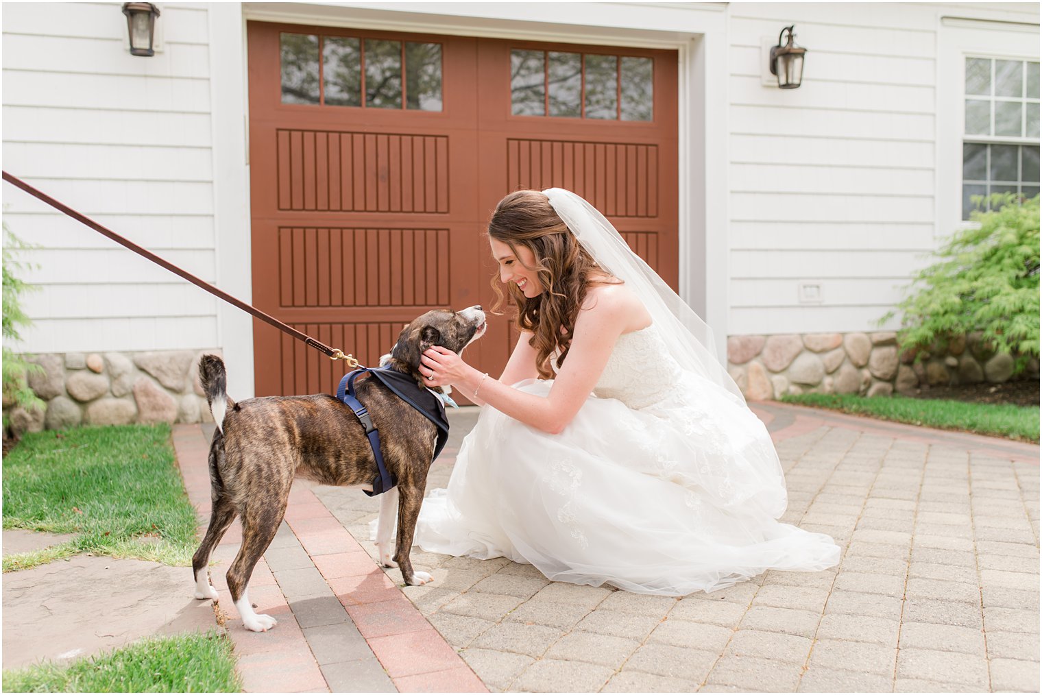 bride pets dog on wedding day in New Jersey 