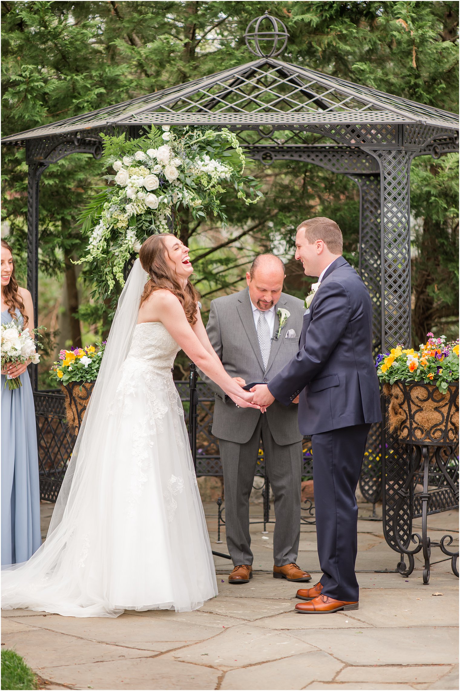 bride and groom laugh during New Jersey wedding ceremony 