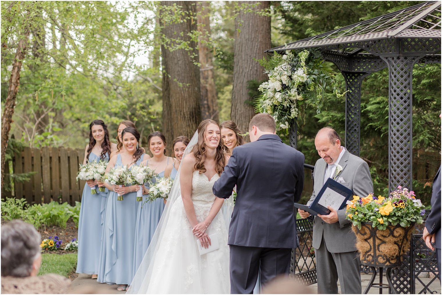 bride laughs during ceremony at The English Manor 