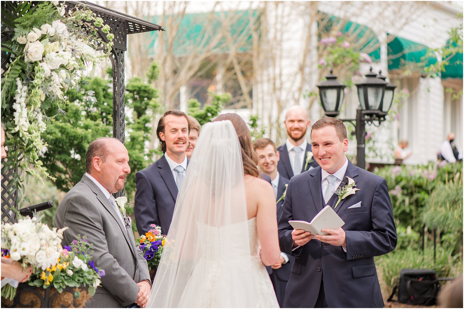 groom reads vows to bride during NJ wedding day