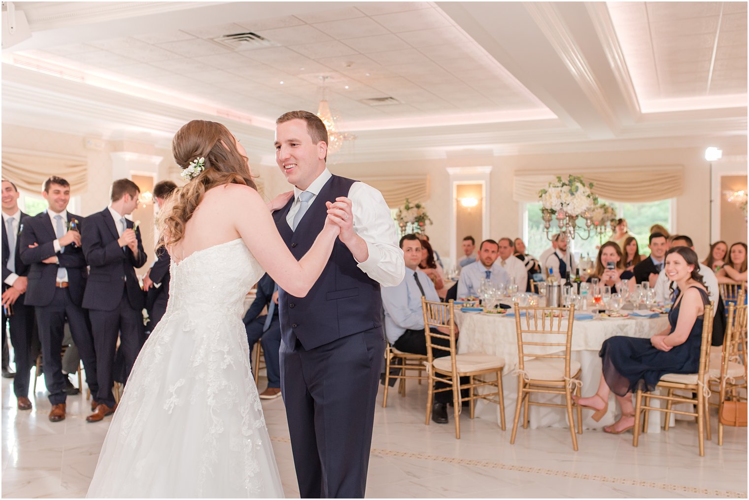 newlyweds have first dance in English Manor reception hall 