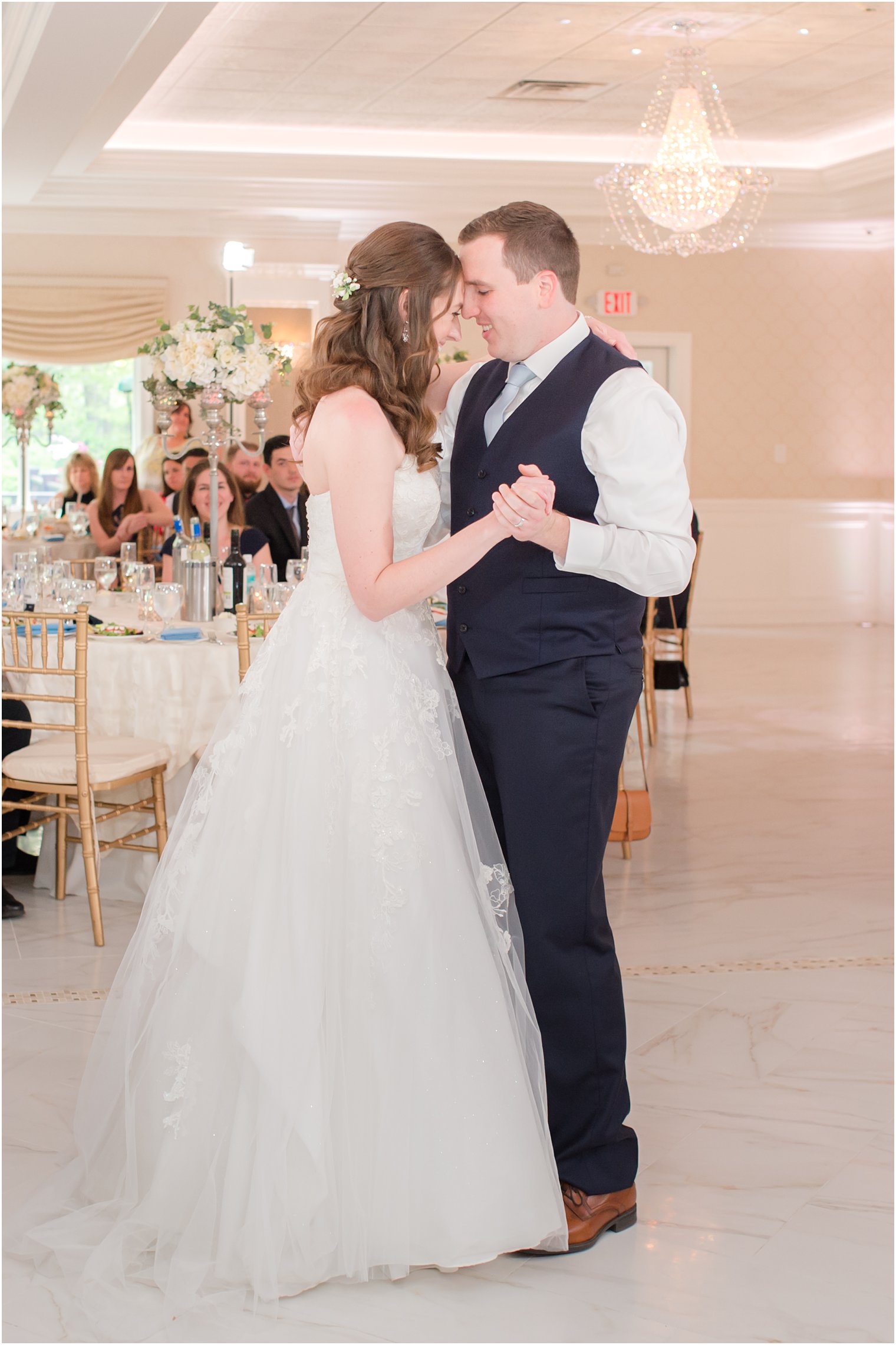 bride and groom have first dance during spring English Manor wedding reception 