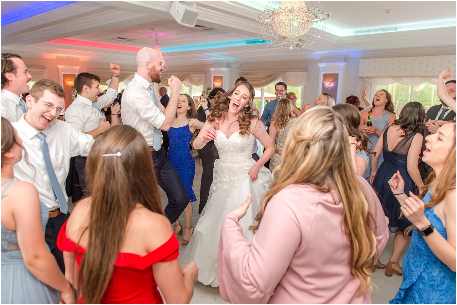 bride dances with family and friends at NJ wedding reception 